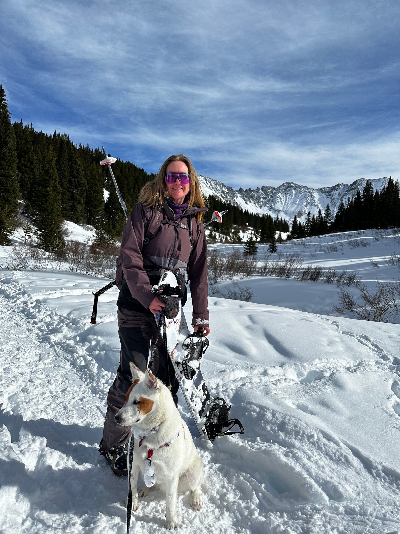 Dr Hartley snowboarding with dog